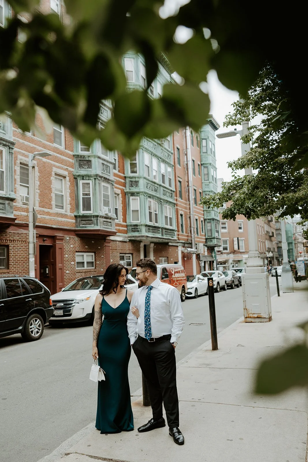 A couple posing at one of my favorite MAssachusetts engagement photo locations in North End