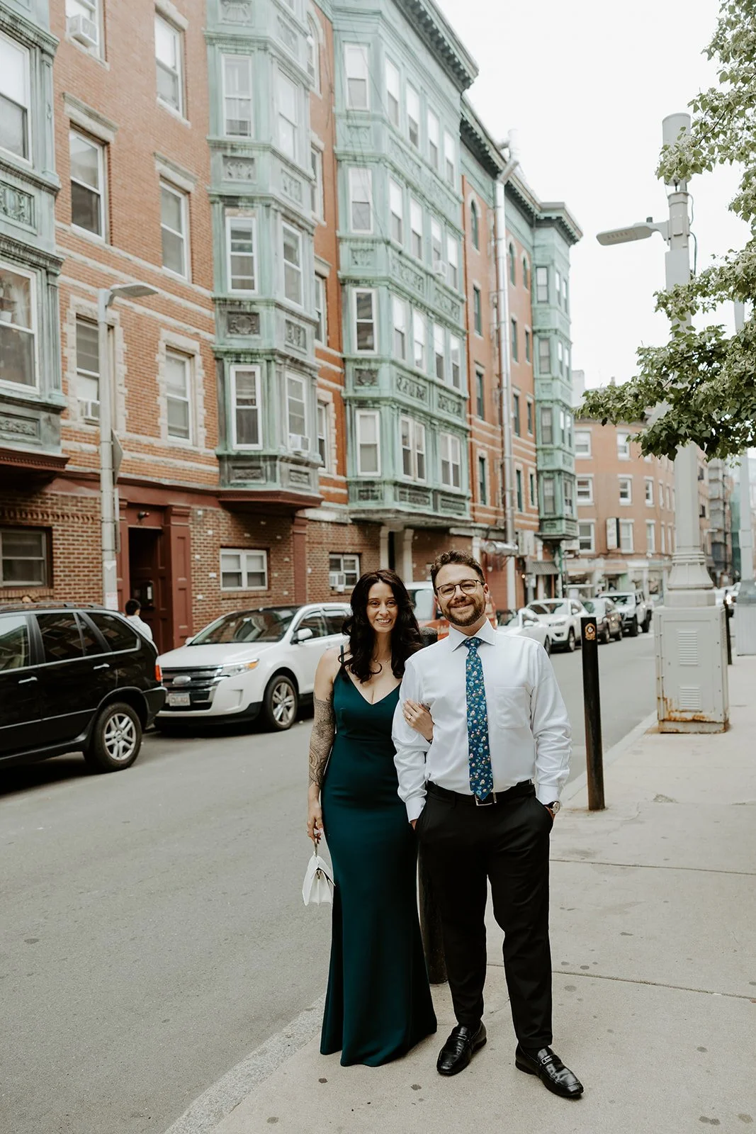 A couple posing at one of my favorite MAssachusetts engagement photo locations in North End