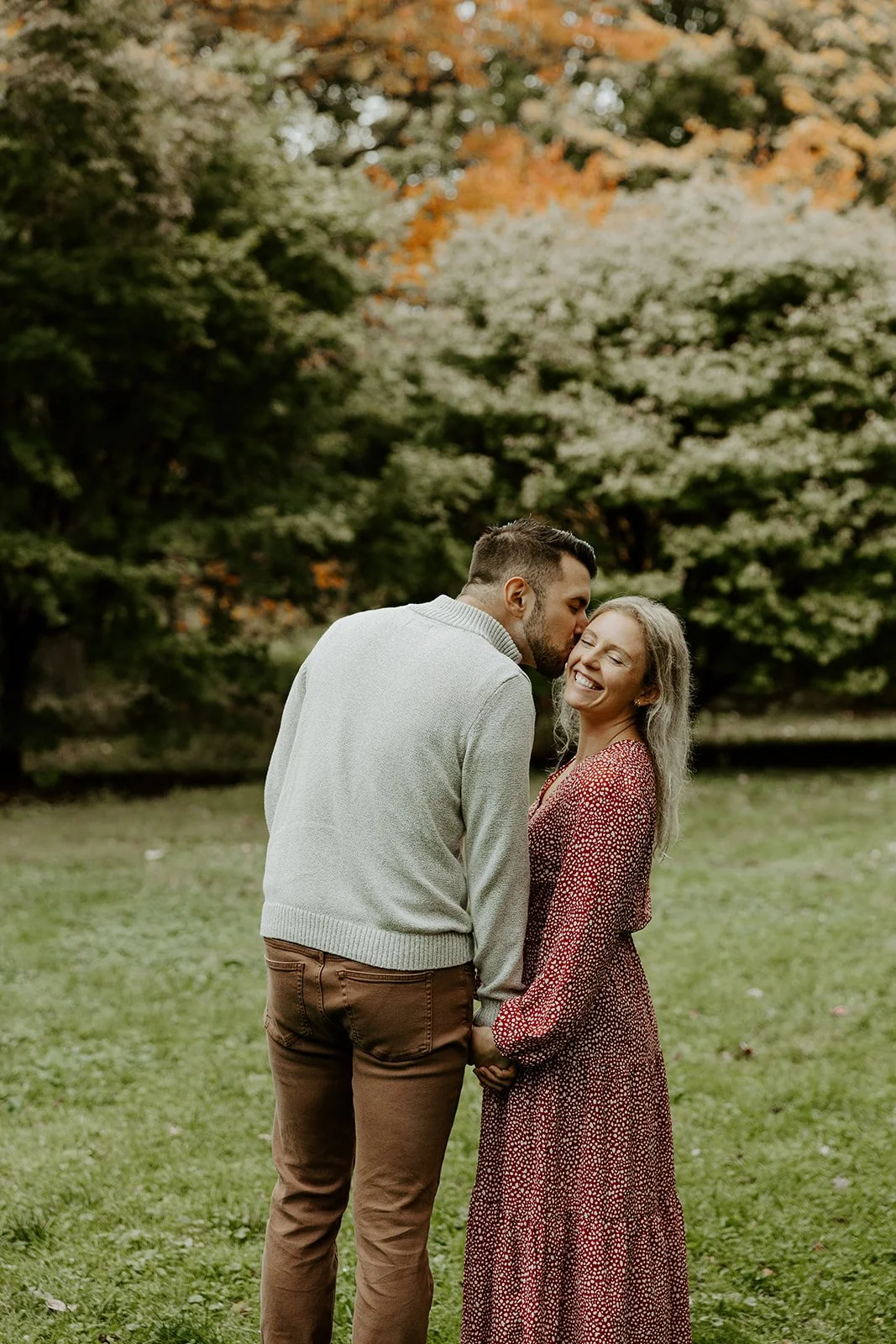 A couple posing for engagement photos at a Massachusetts engagement photo location