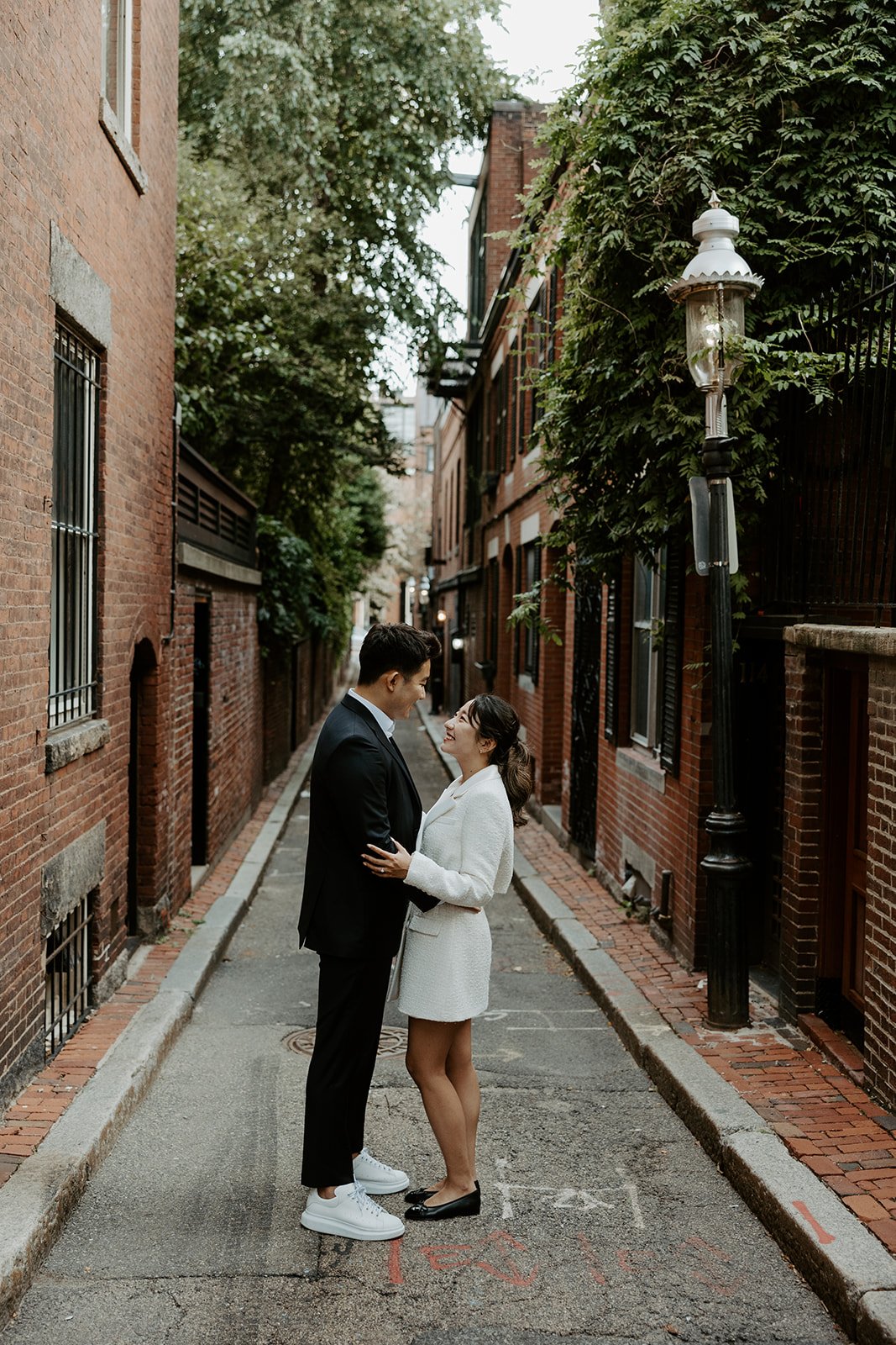 A couple posing for Beacon Hill engagement photos