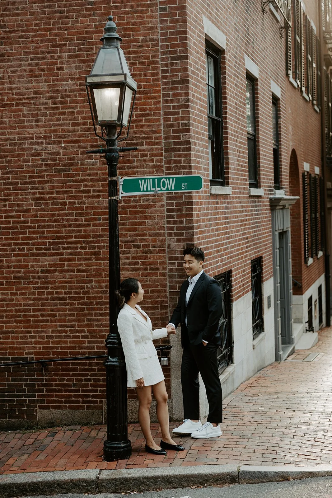 A couple posing for Beacon Hill engagement photos