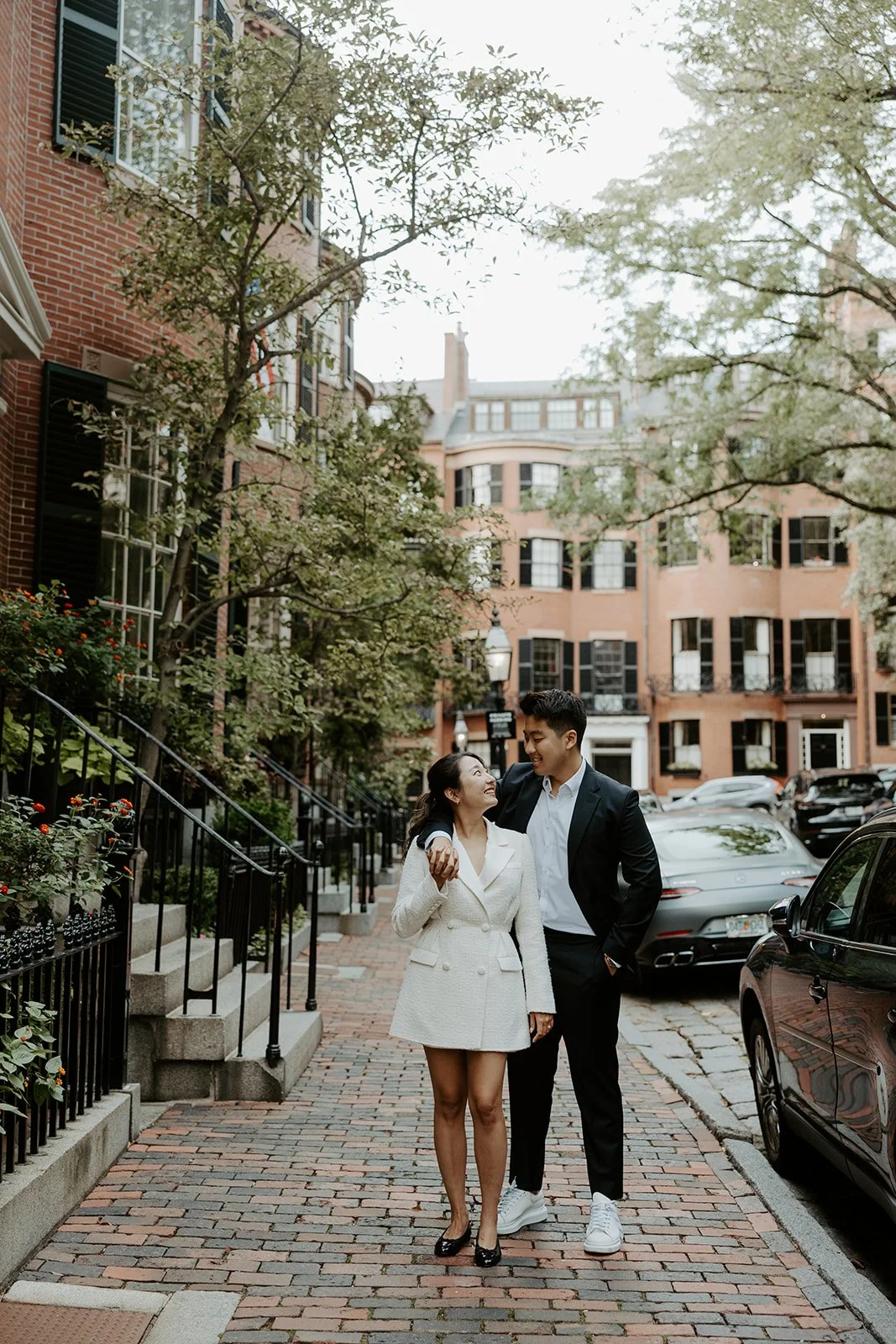 A couple posing for Massachusetts engagement photos in Beacon Hill