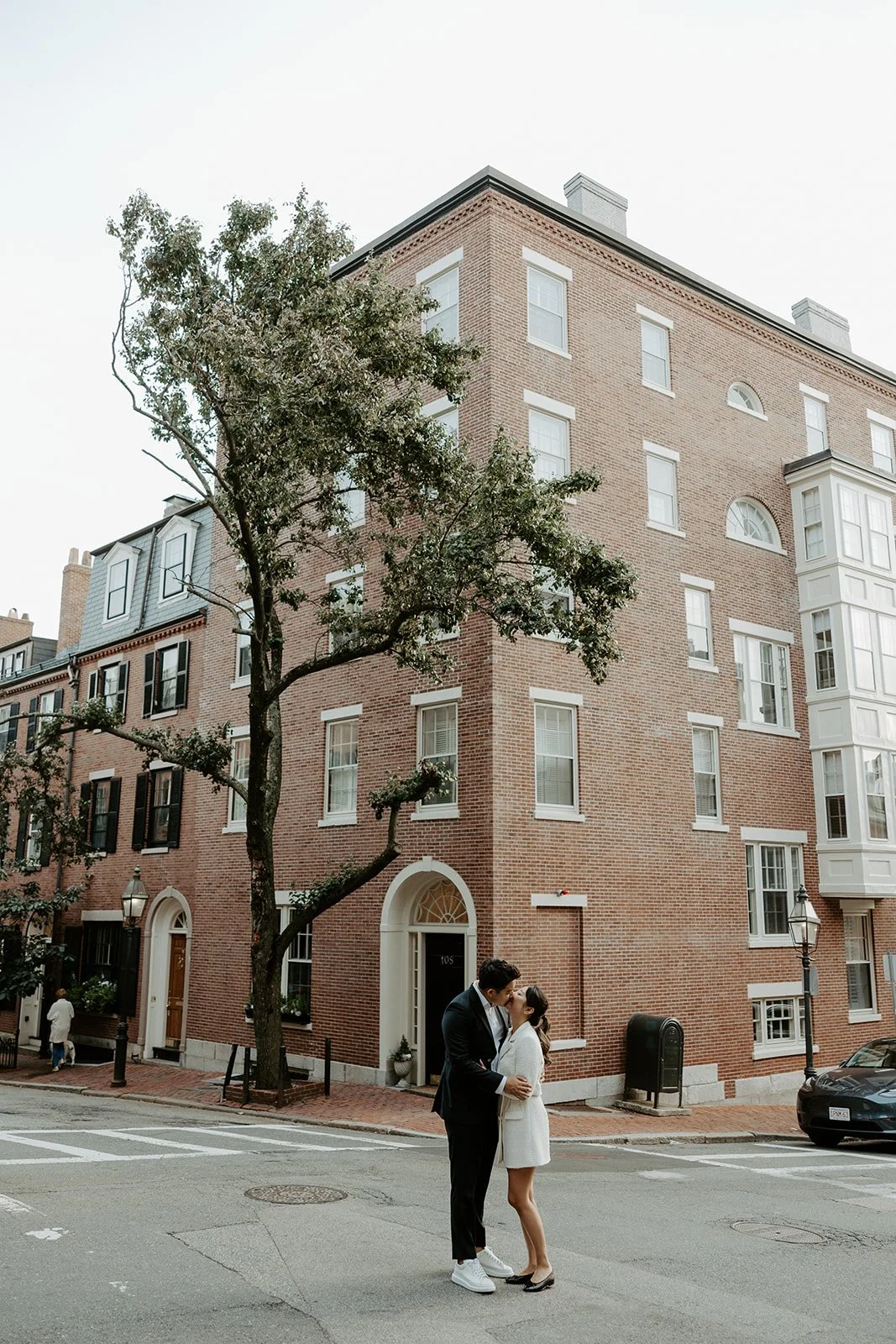 A couple posing for Massachusetts engagement photos in Beacon Hill