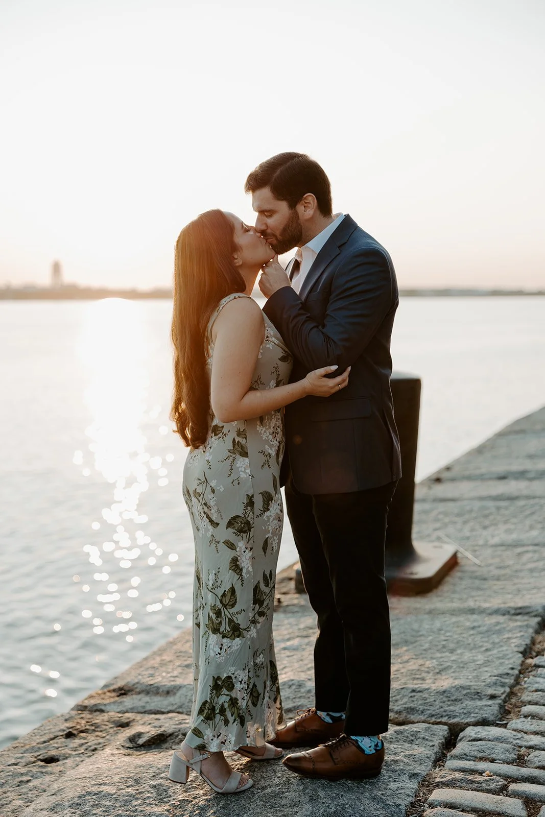 A couple posing for photos at Massachusetts engagement photo location Fan Pier Park