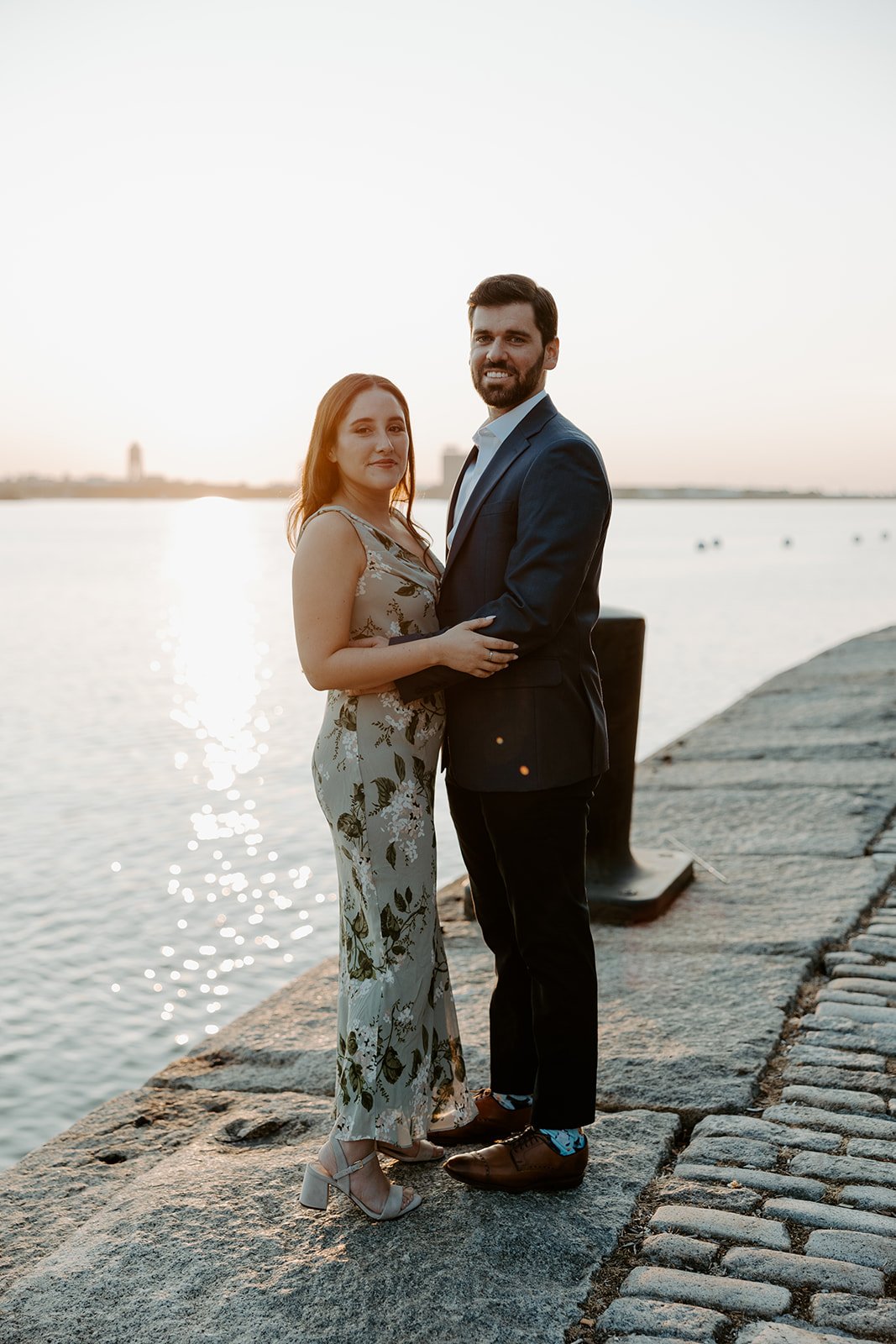 A couple posing for photos at Massachusetts engagement photo location Fan Pier Park