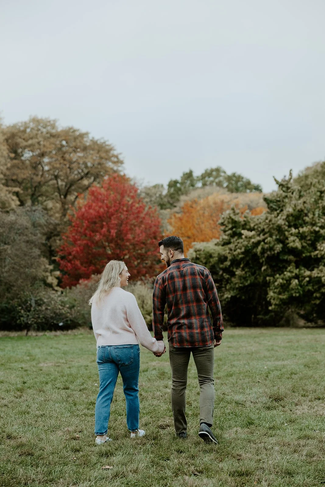 A couple posing for Boston fall engagement photos