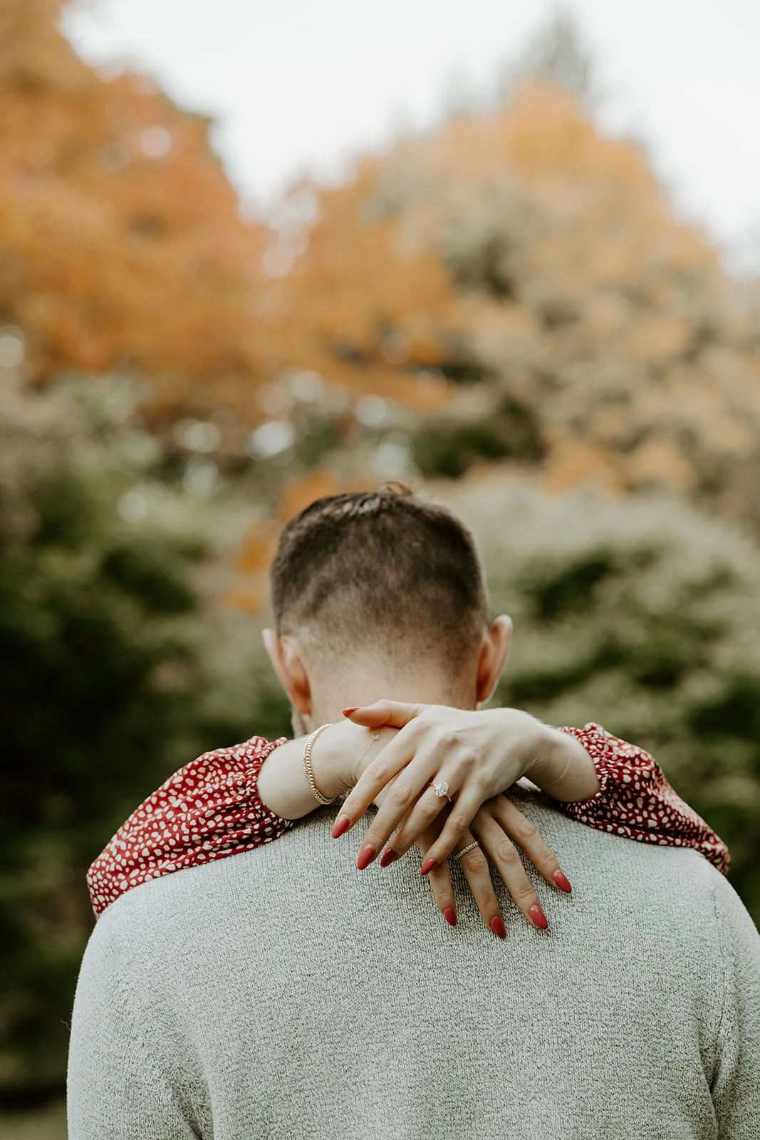 A couple posing for Boston fall engagement photos