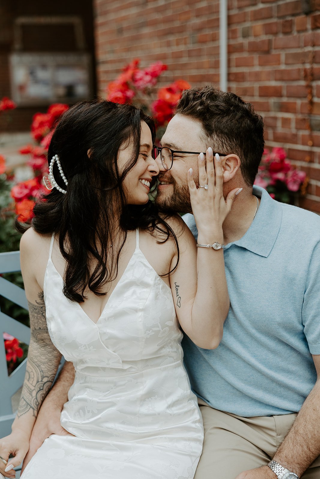 A couple leaning in for a kiss during engagement photos