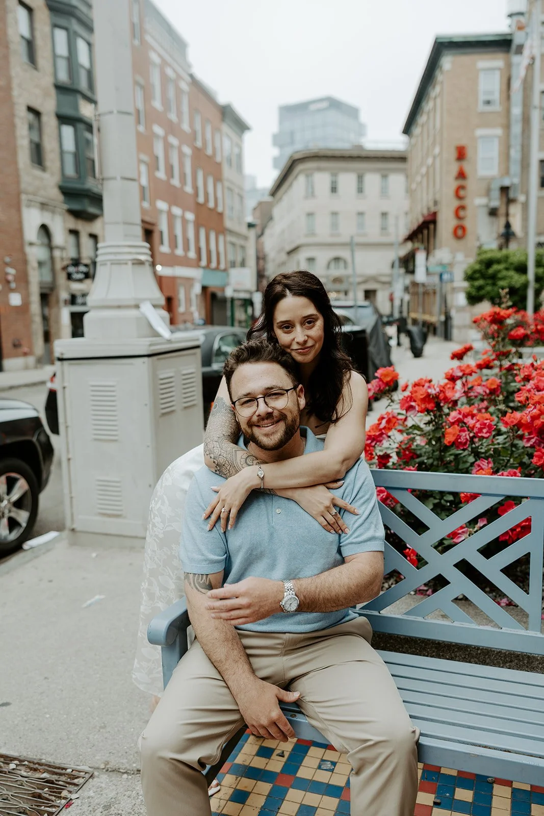 A woman hugging her fiance during engagement photos