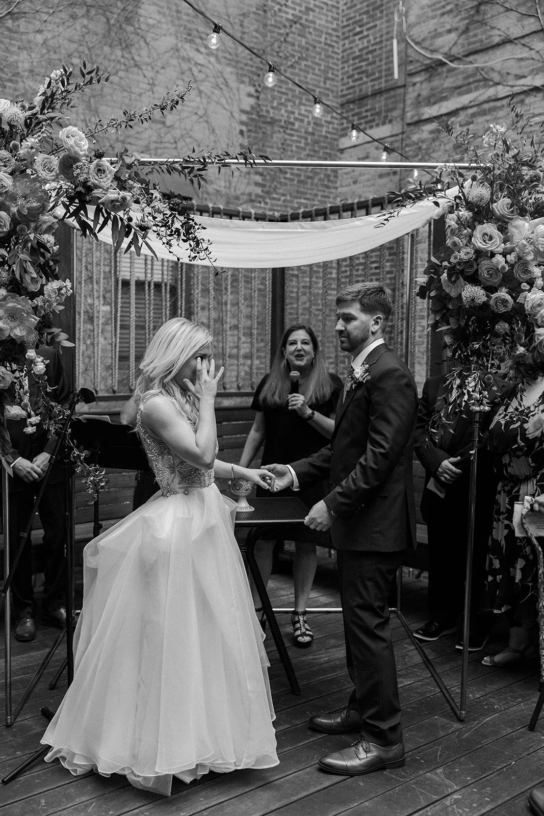 A bride crying during a restaurant wedding ceremony