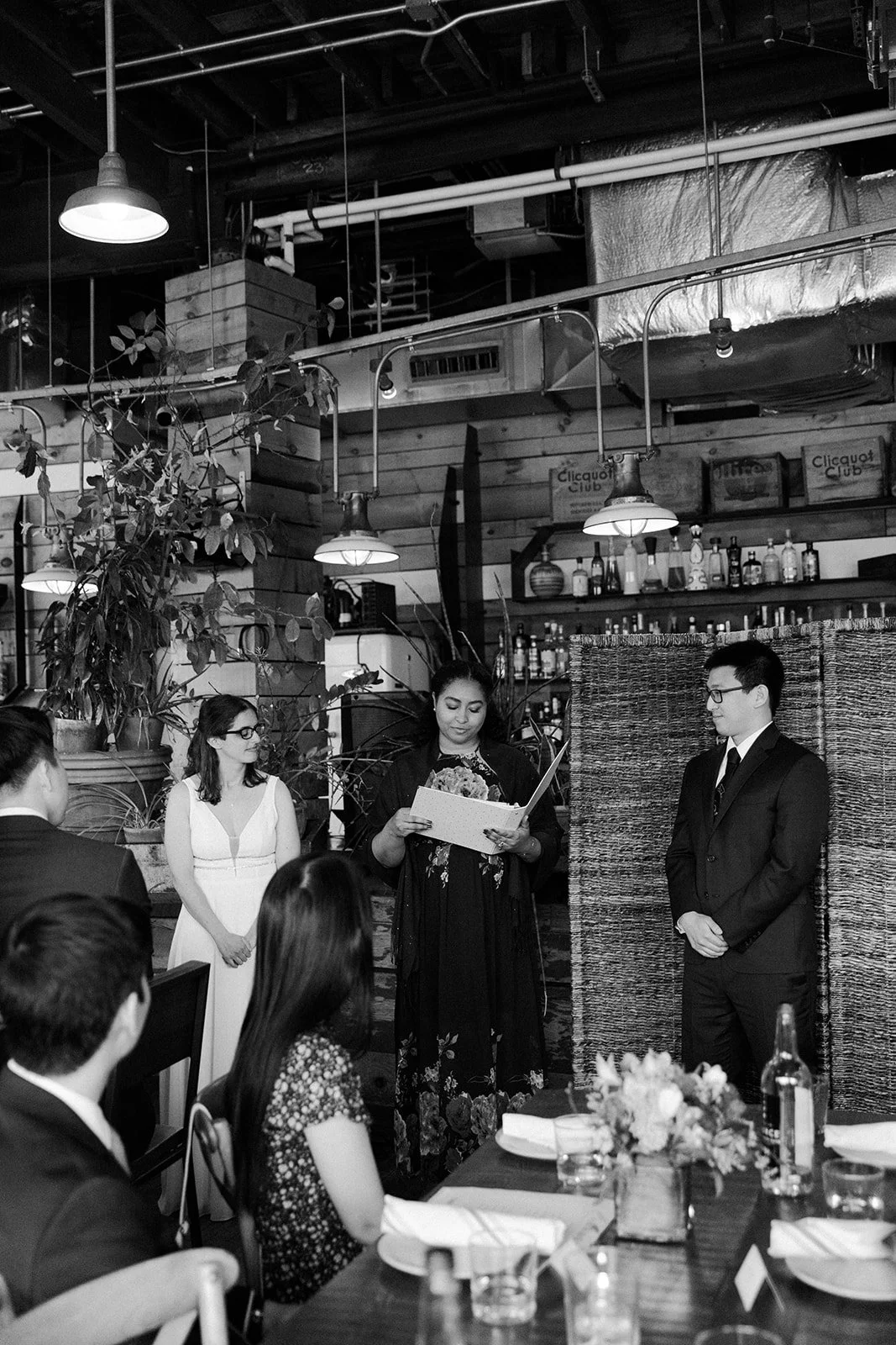 A bride and groom during their restaurant wedding ceremony