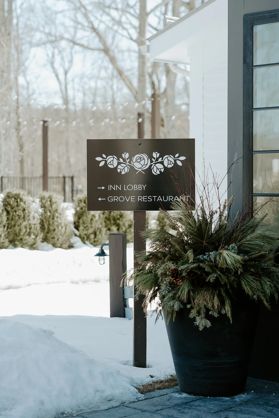 A wedding venue sign in the snow for an off season wedding