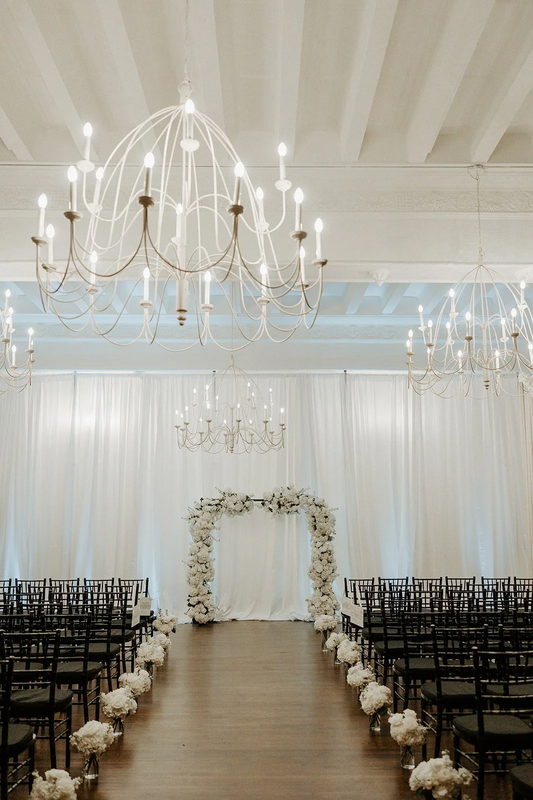 A wedding ceremony setup indoors for a winter wedding