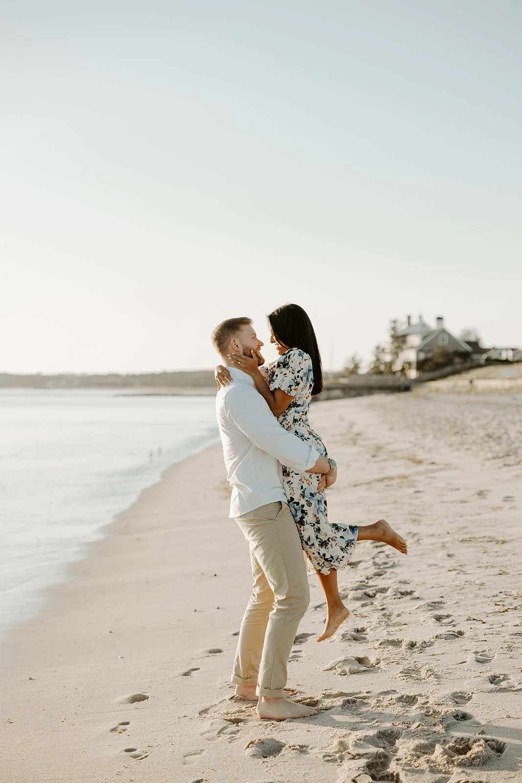 A couple showing what to wear for beach engagement photos