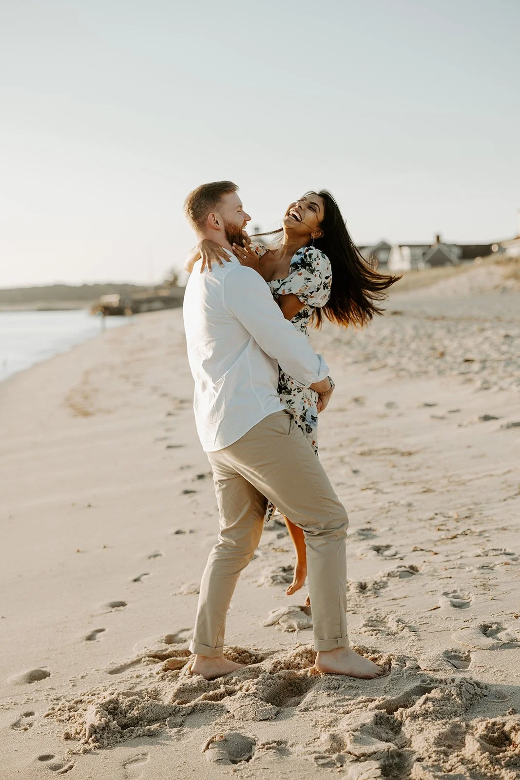A couple showing what to wear for beach engagement photos