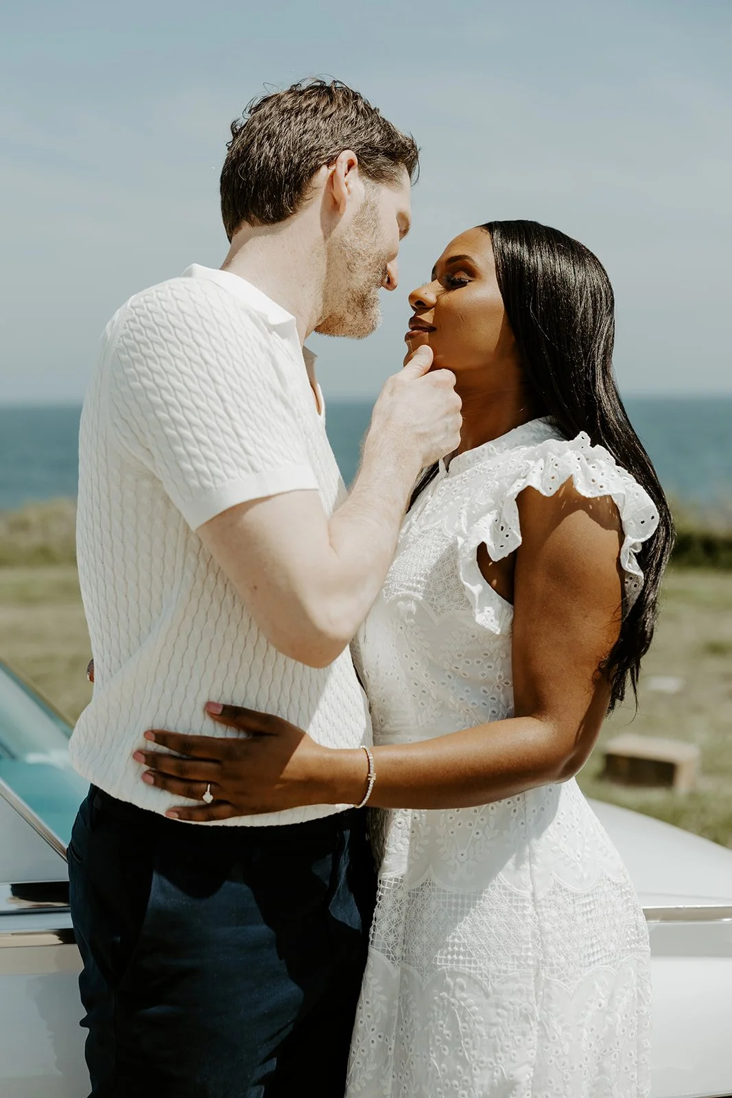 A couple showcasing what to wear for summer engagement photos