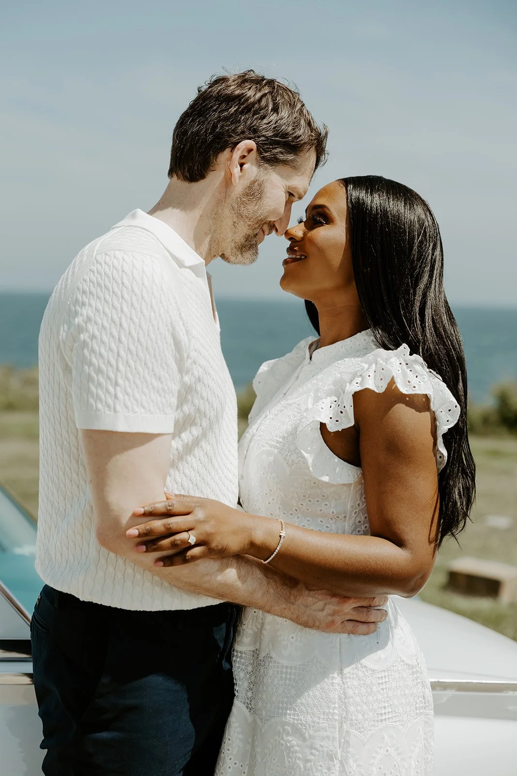 A couple showcasing what to wear for summer engagement photos