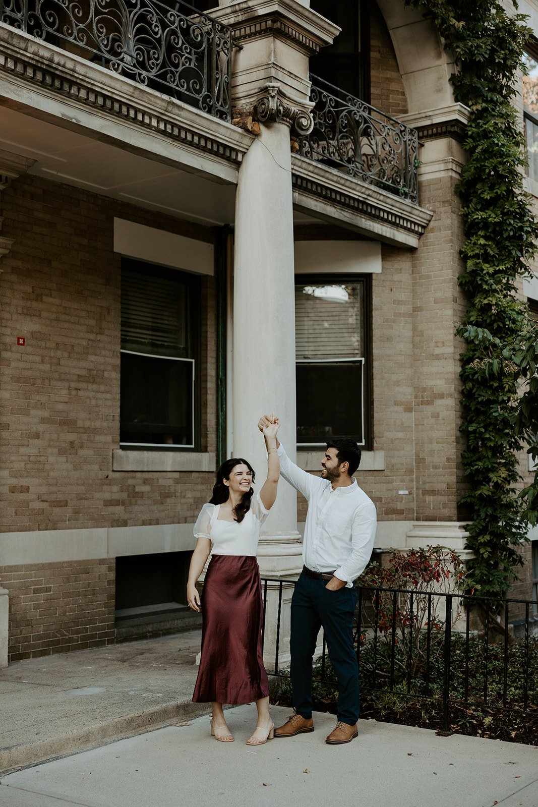 A couple dancing during their engagement photos