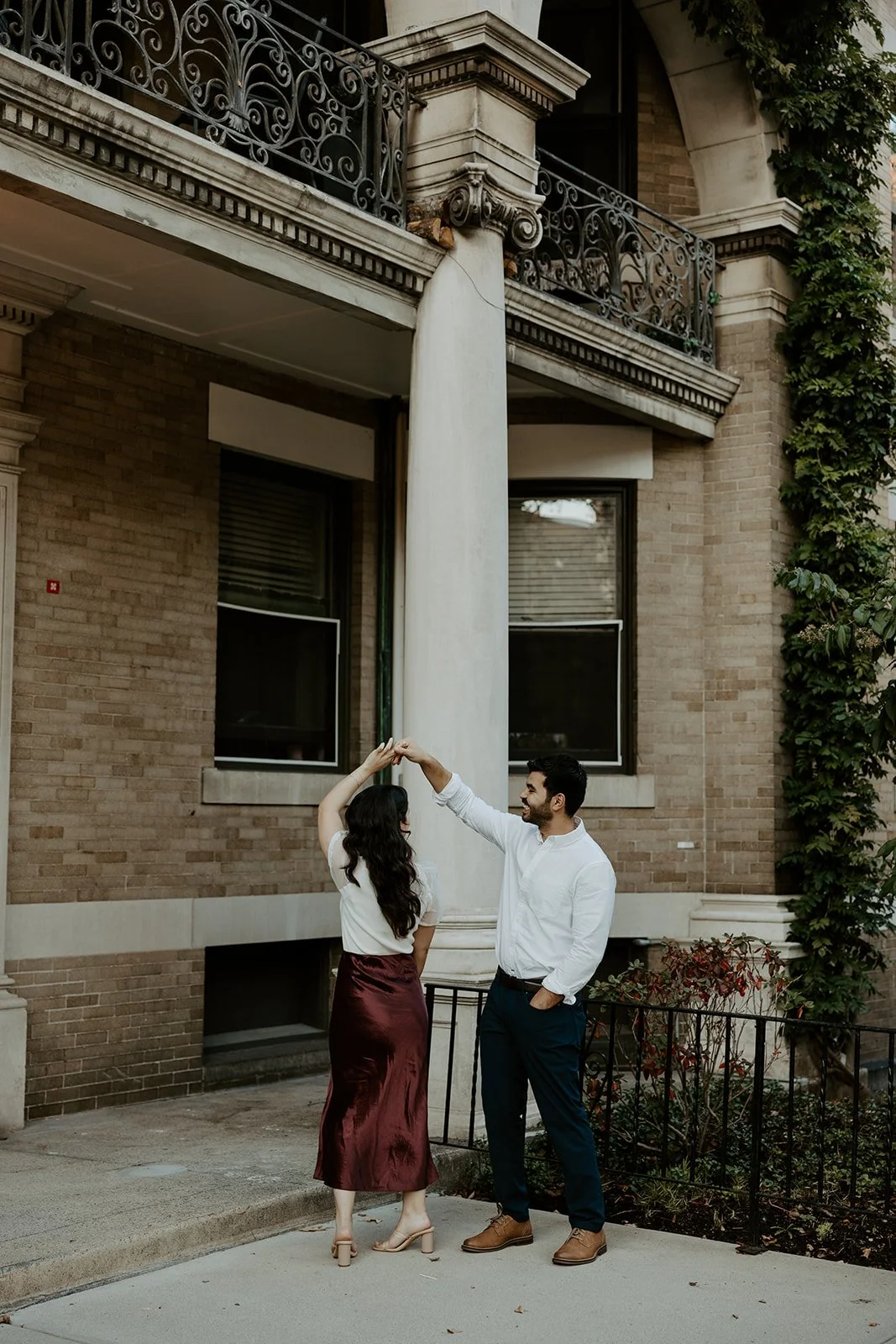 A couple dancing during their engagement photos