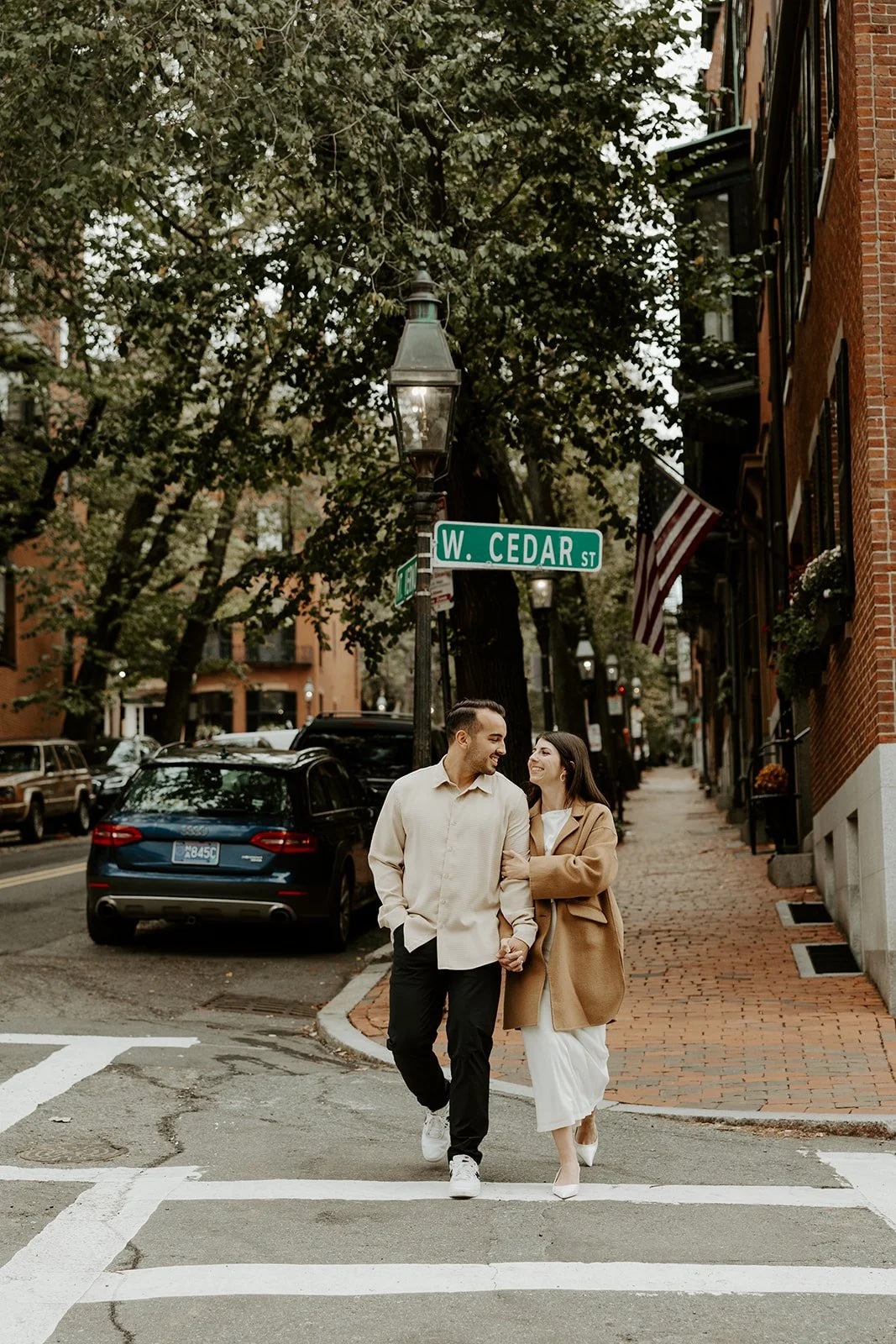A couple walking down the street during their engagement photos