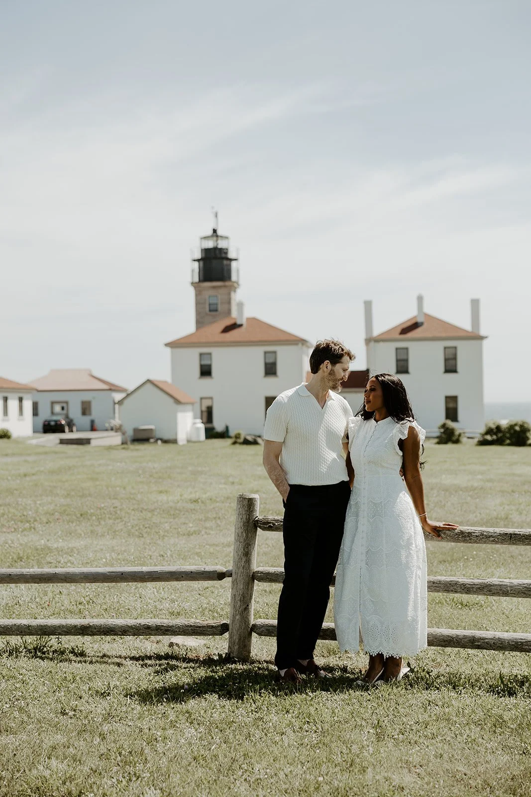 A couple taking coastal engagement photos