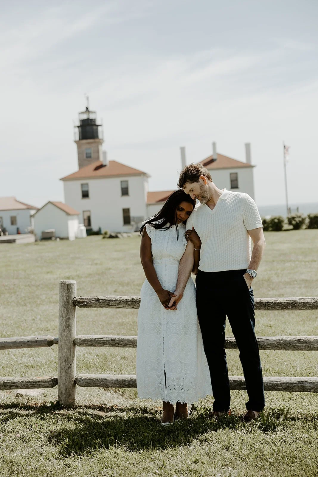 A couple taking coastal engagement photos