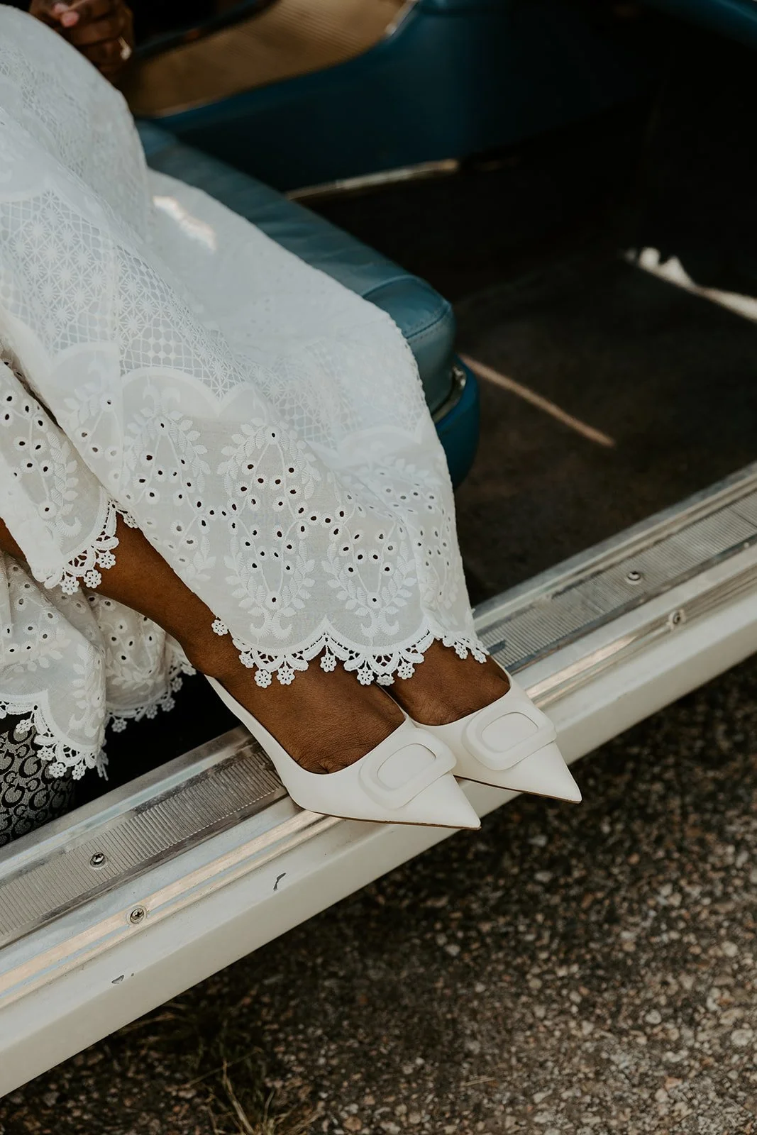 A woman showing off her engagement photo shoes