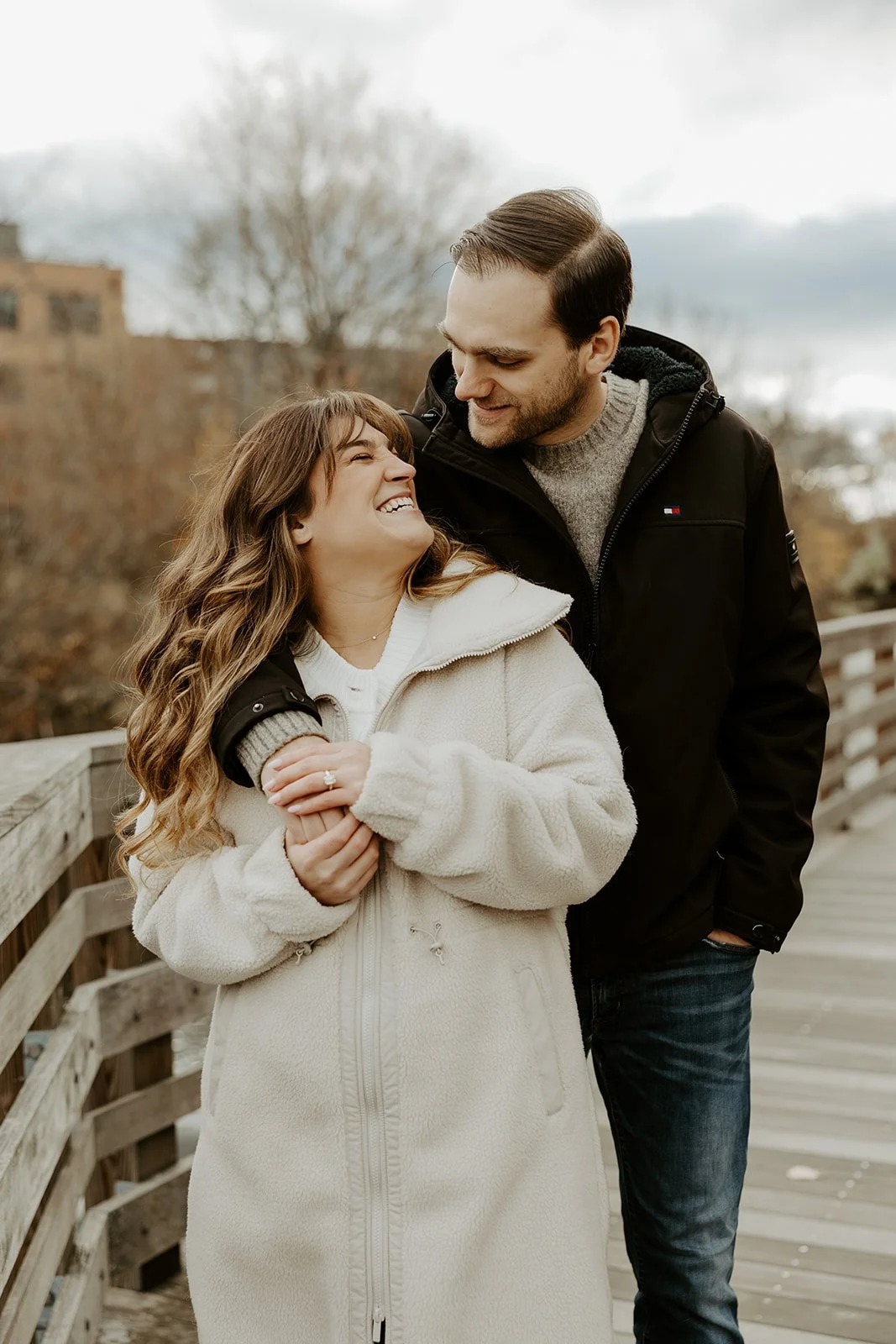 A couple posing for winter engagement photos