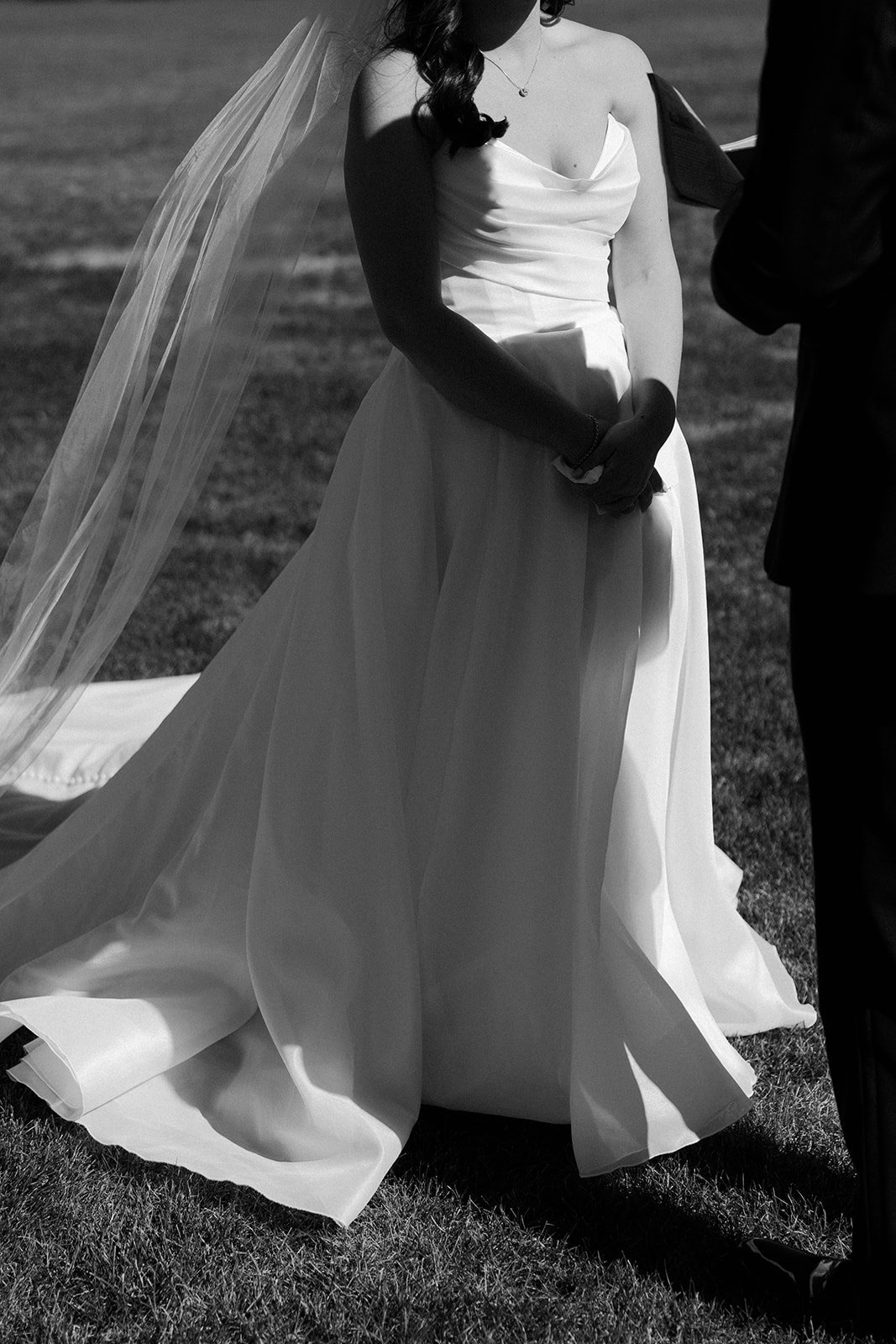 A bride's simple backyard wedding dress during private vows