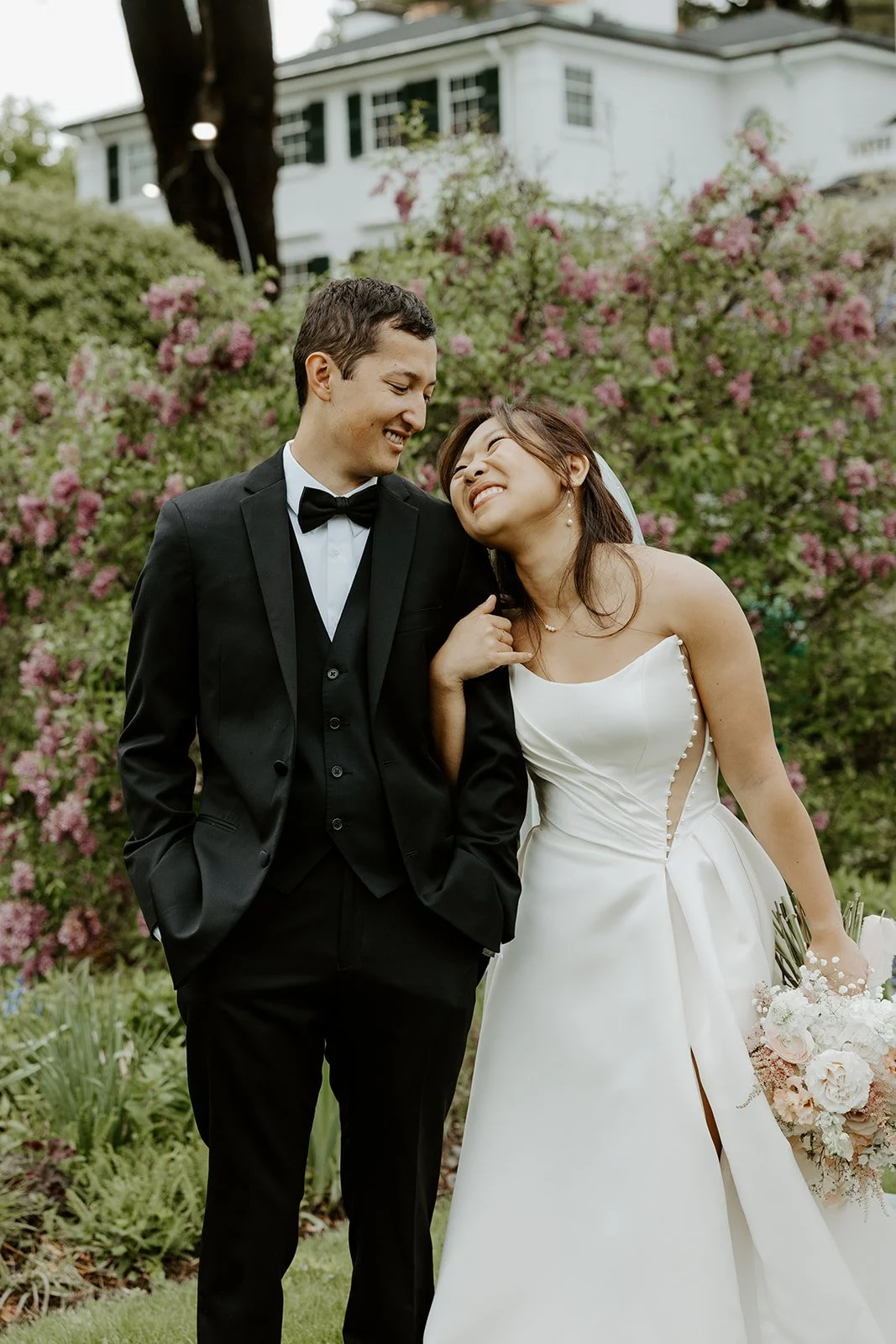 A couple posing for wedding photos at Glen Magna Farms