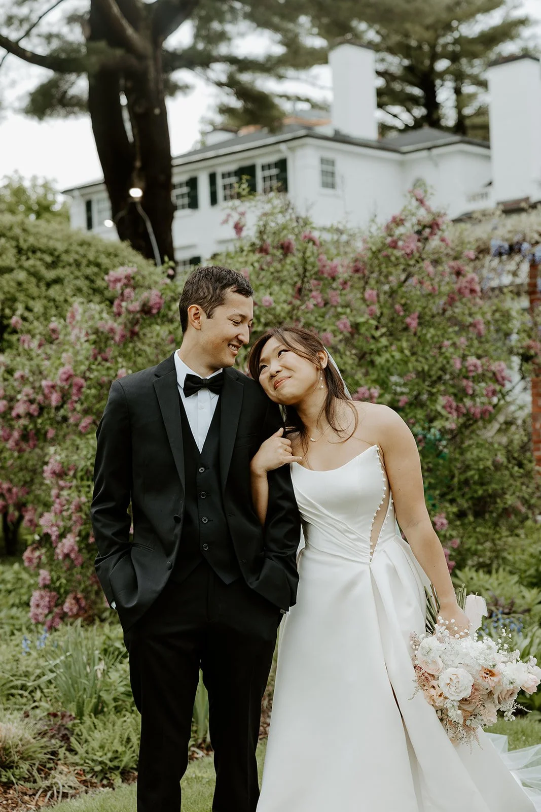 A couple posing for wedding photos at Glen Magna Farms