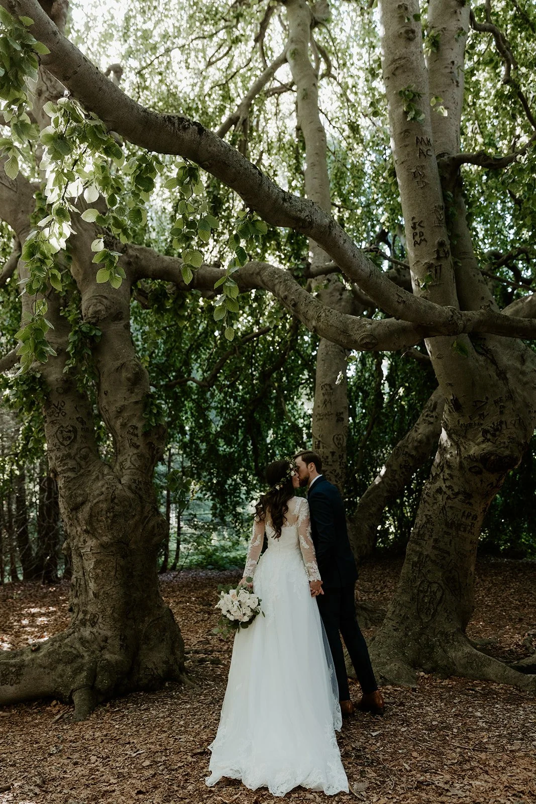 A bride and groom taking wedding photos at Glen Magna Farms