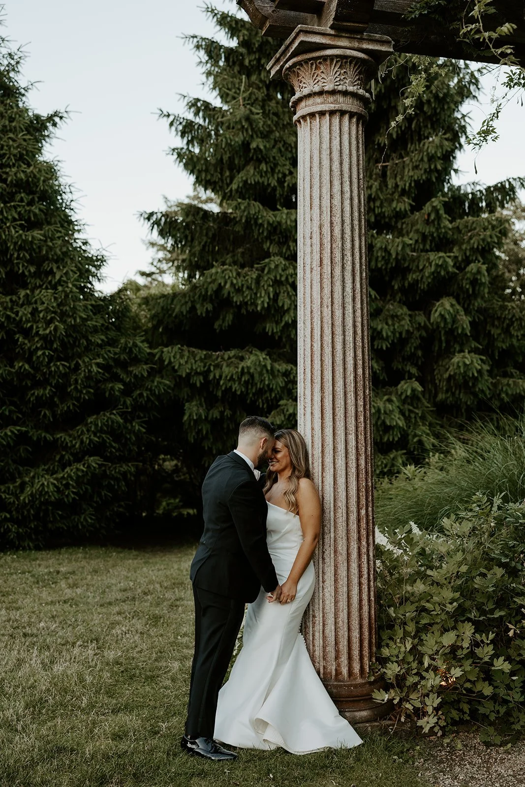 A bride and groom taking wedding photos at Glen Magna Farms