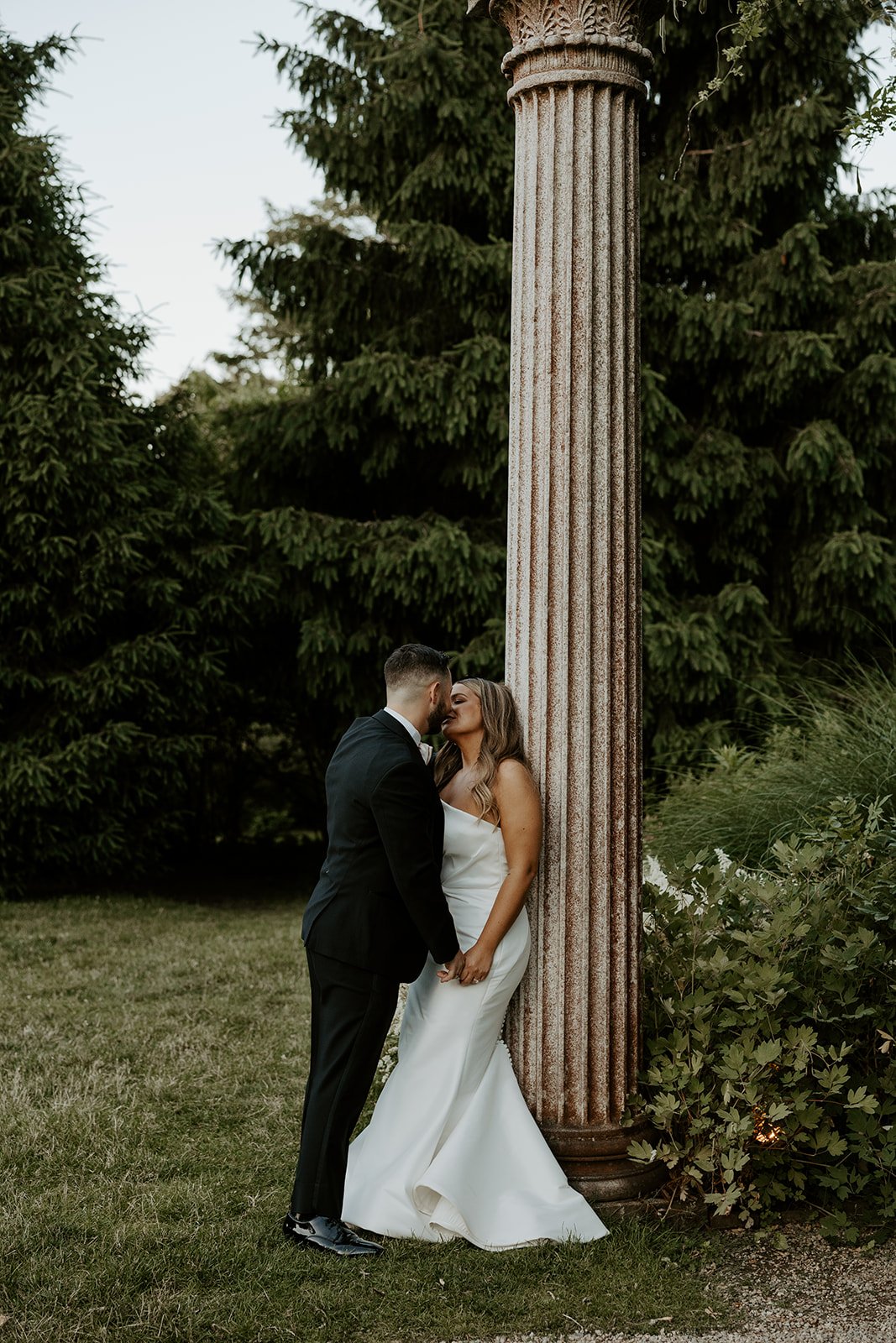 A bride and groom taking wedding photos at Glen Magna Farms