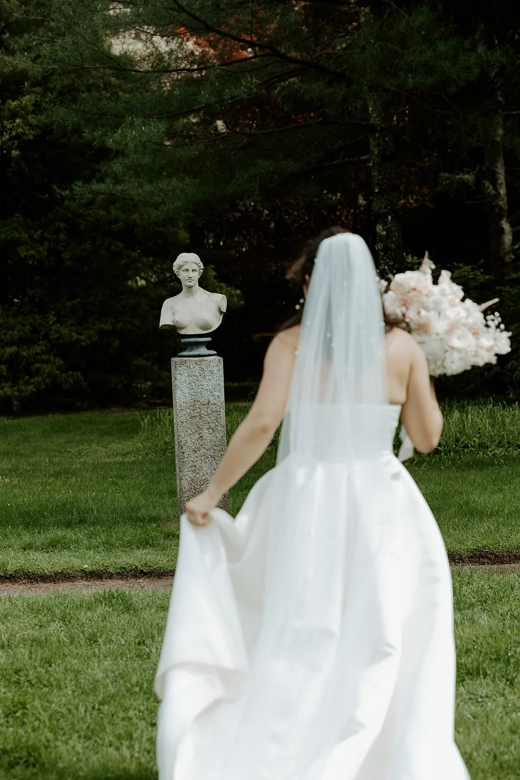 A bride taking bridal portraits at Glen Magna Farms