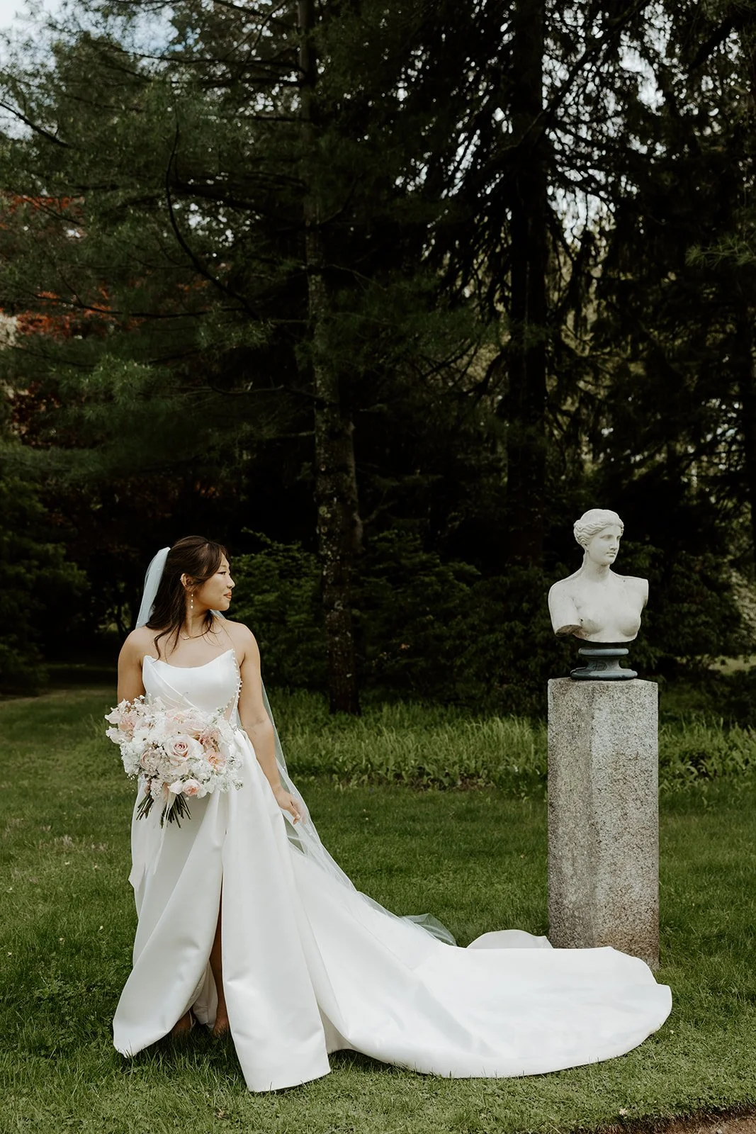 A bride taking bridal portraits at Glen Magna Farms