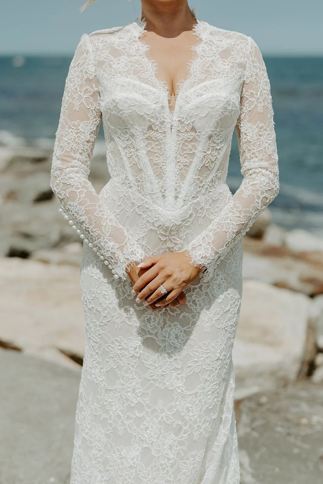 A bride posing for bridal portraits in her how to plan a wedding guide