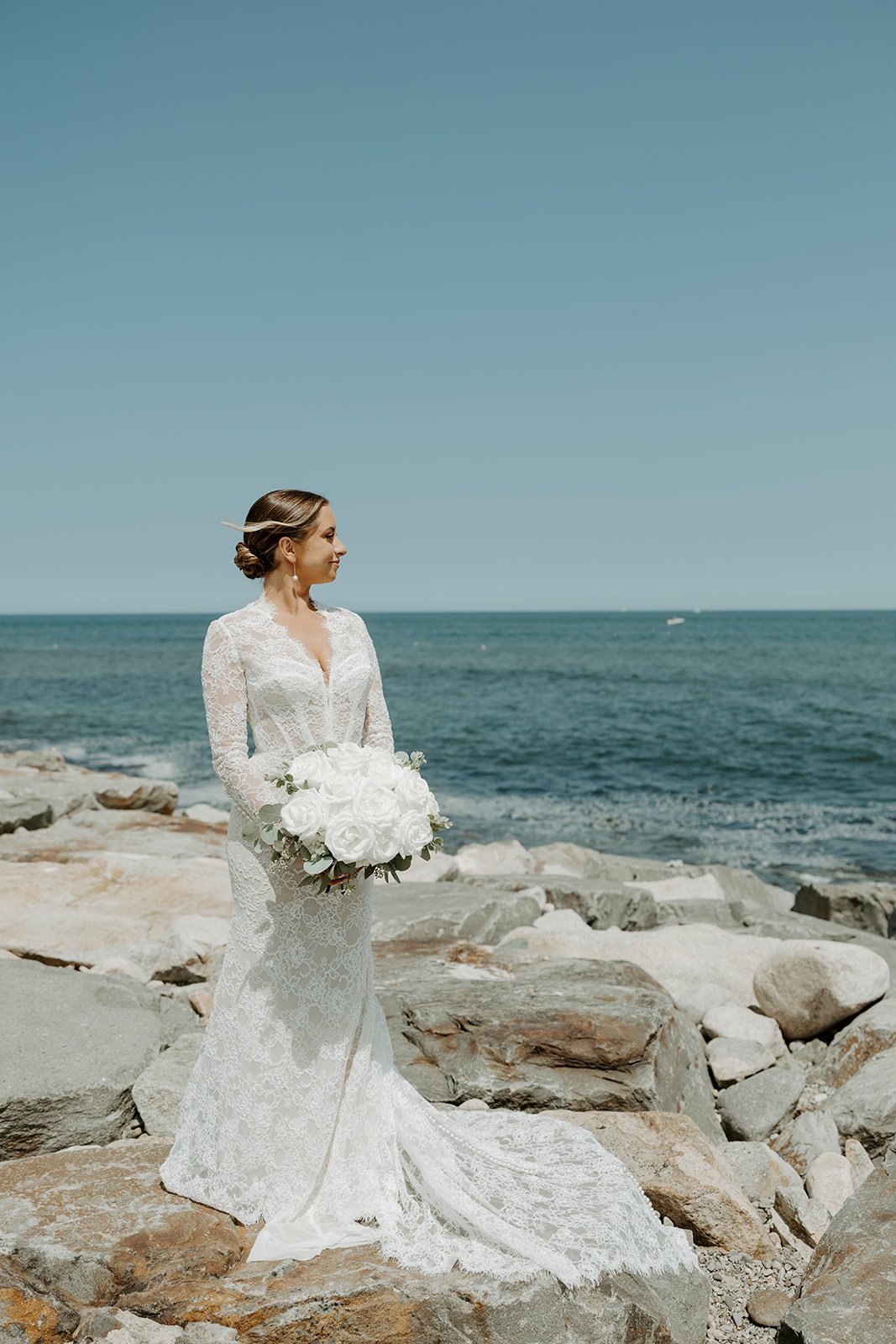 A bride posing for bridal portraits in her how to plan a wedding guide