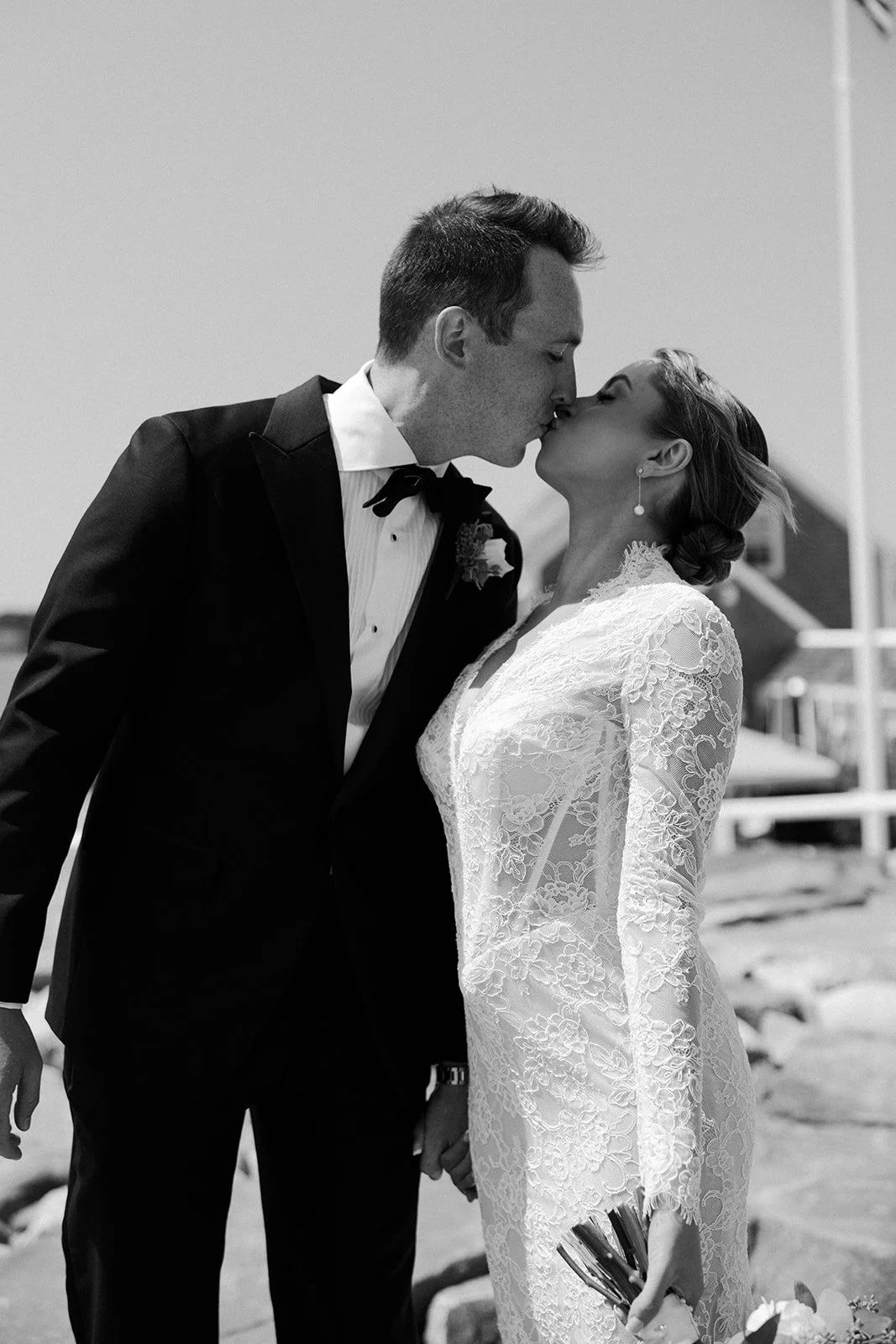 A black and white wedding photo of a bride and groom at the end of a blog post on how to plan a wedding