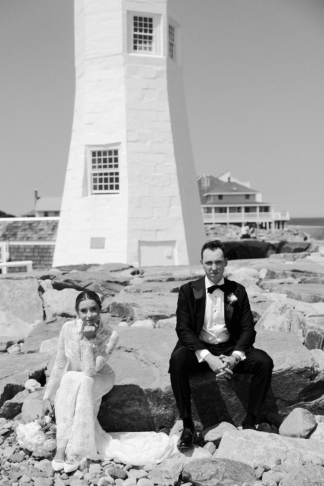 A black and white wedding photo of a bride and groom at the end of a blog post on how to plan a wedding