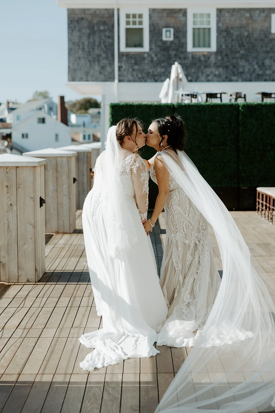 Two brides walking hand in hand at the beginning of a wedding planning checklist