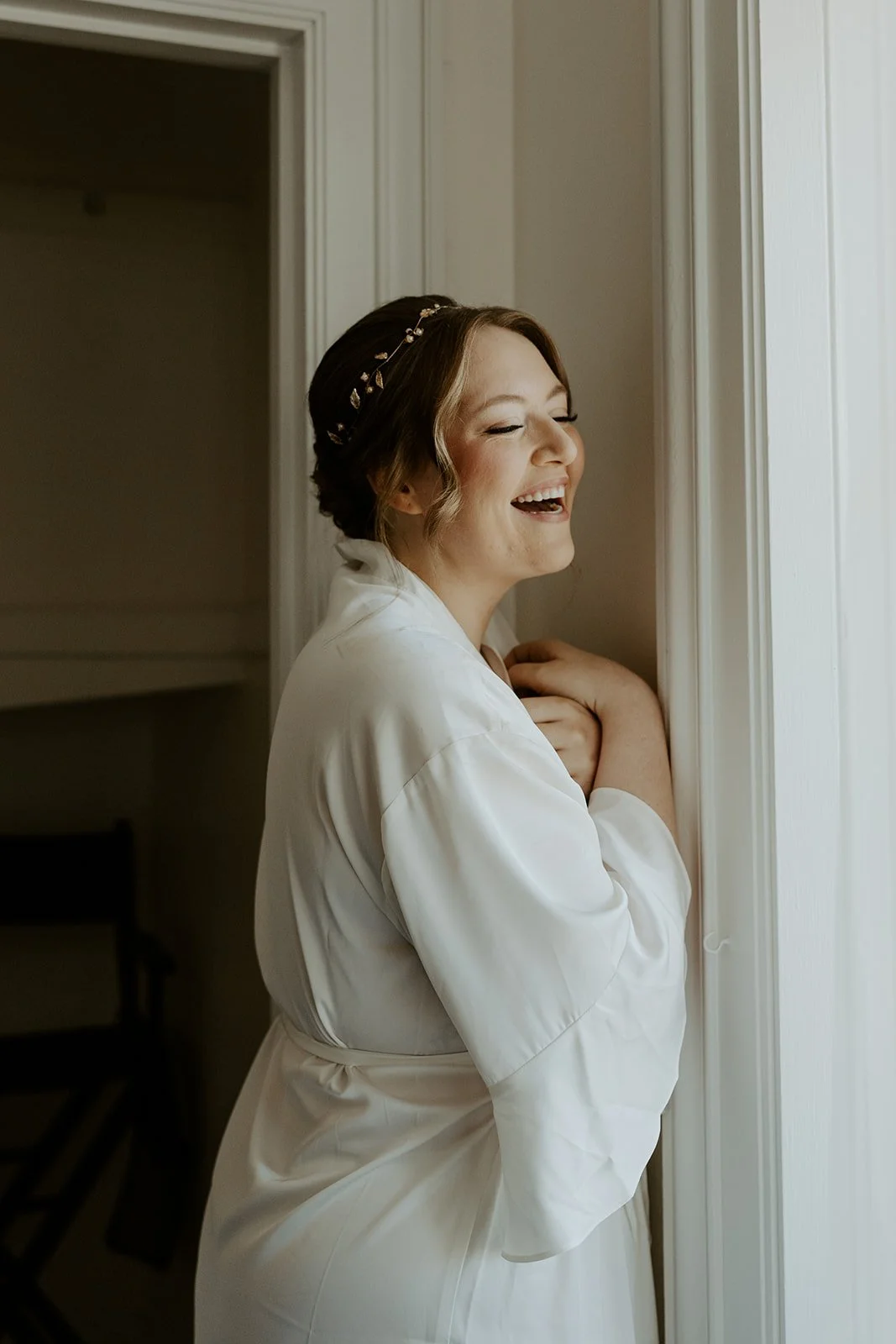 A bride in her wedding getting ready outfit