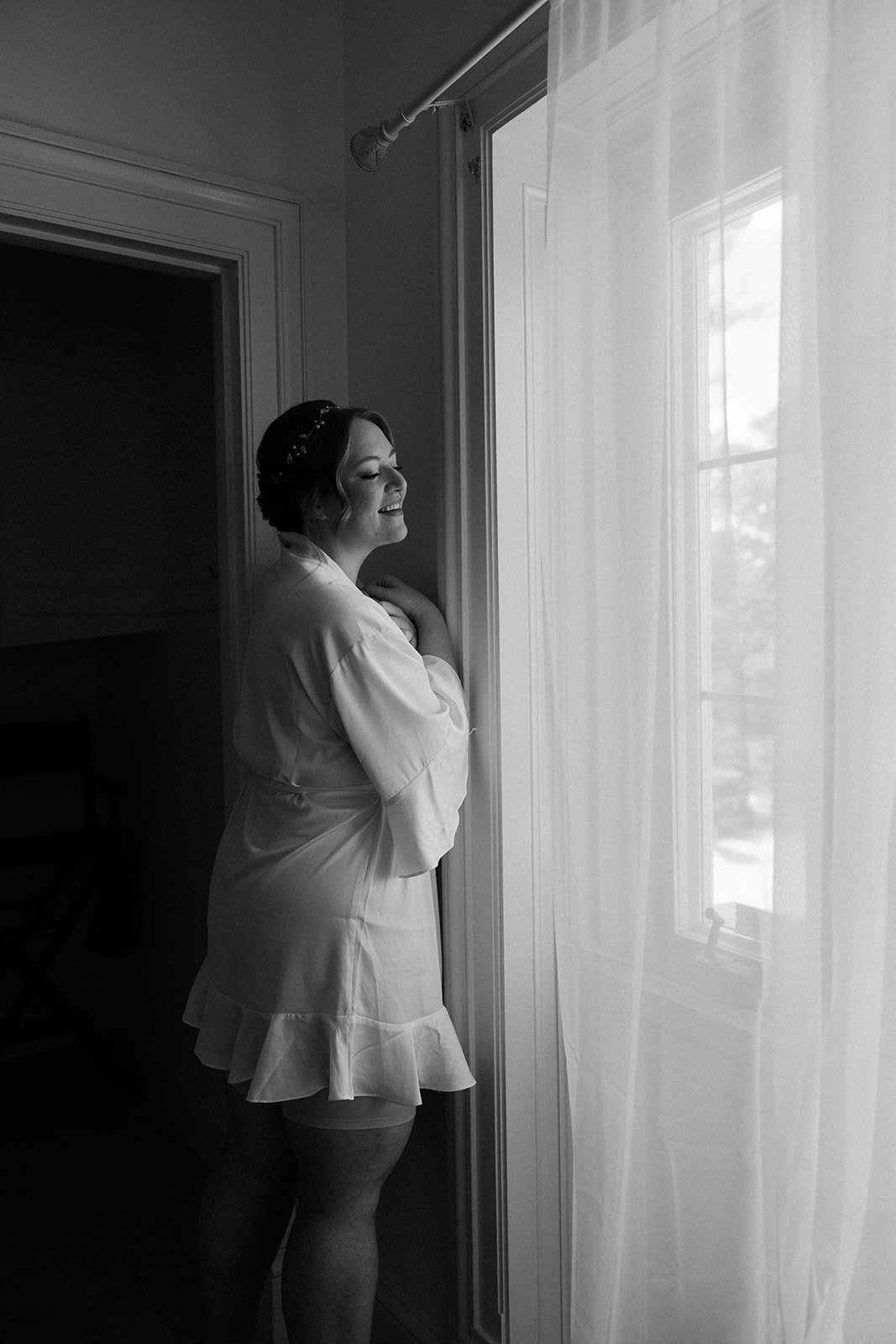 A bride in her wedding getting ready outfit