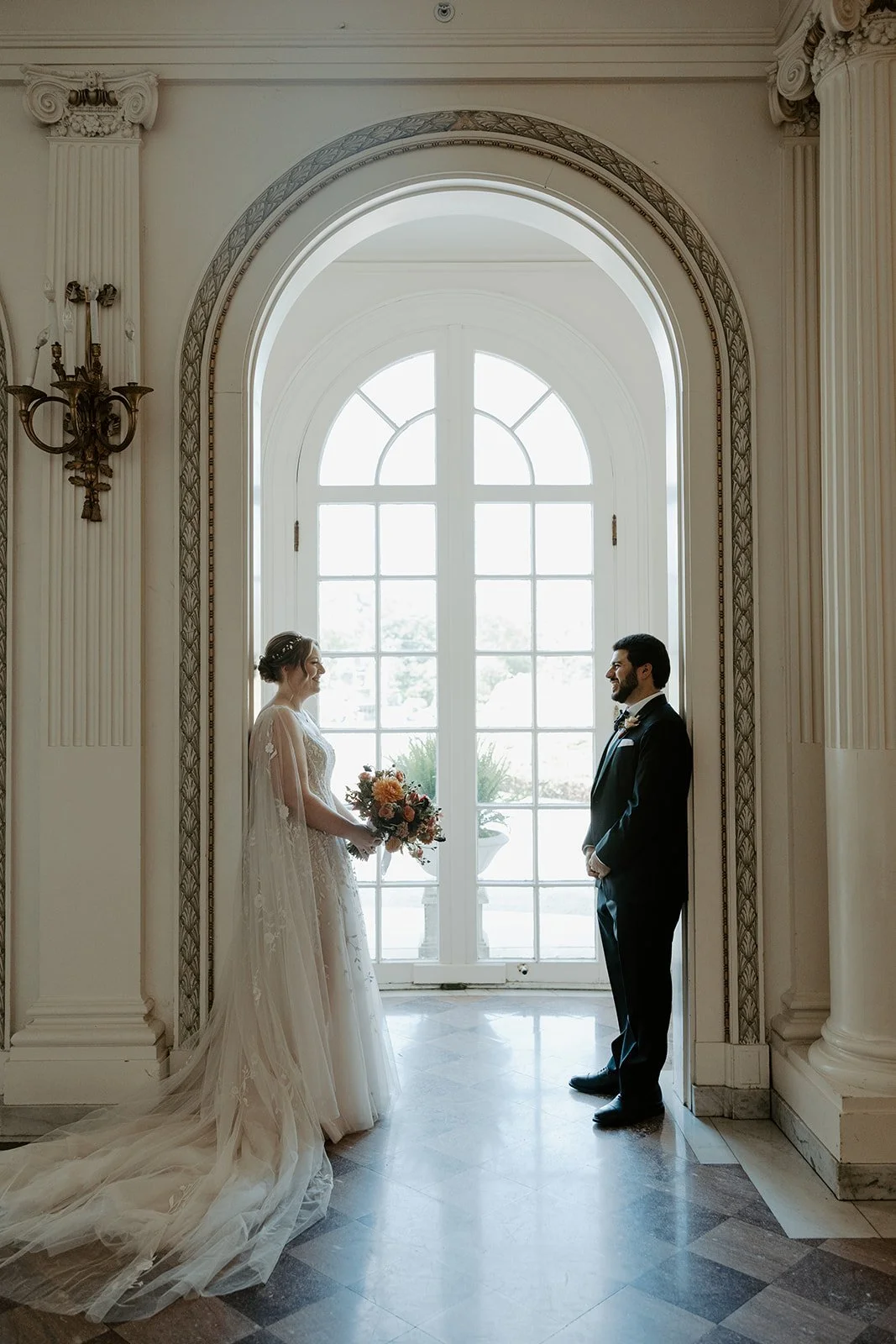 A bride and groom taking photos for a wedding planning checklist