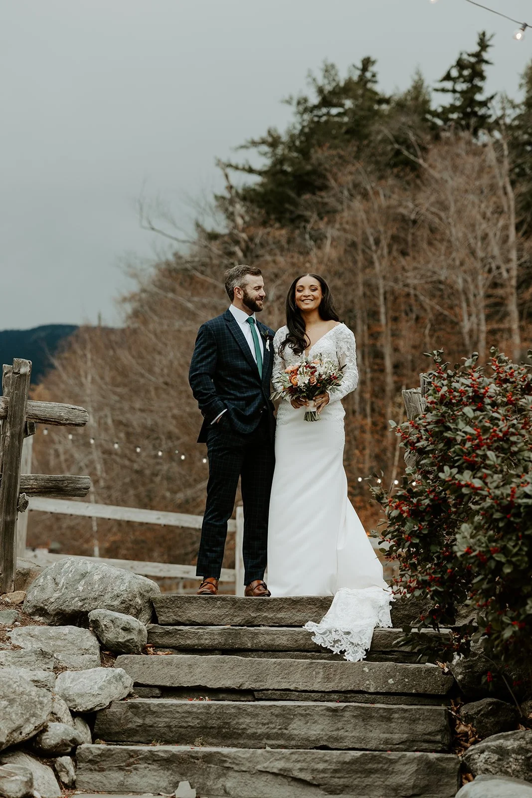 A bride and groom posing for photos at Sugarbush Inn