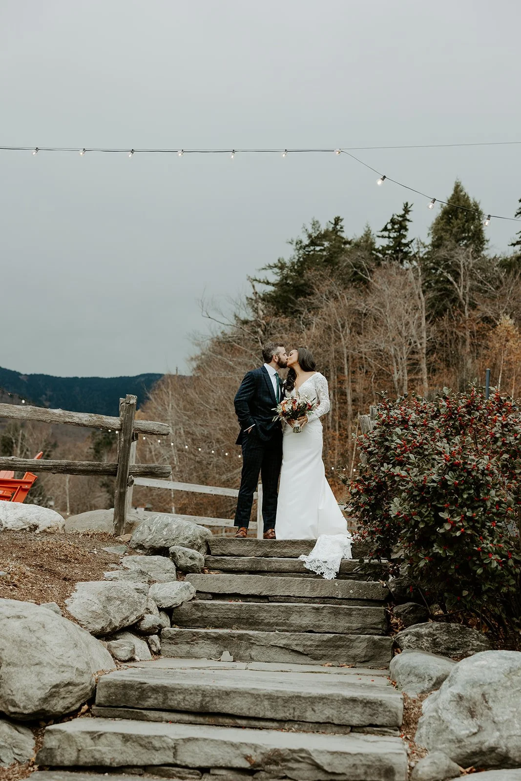 A bride and groom posing for photos at Sugarbush Inn