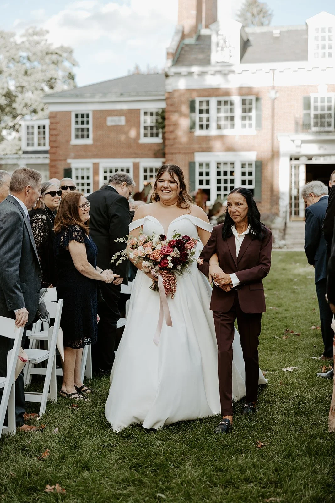 A bride walking down the aisle at her Bradley Estate wedding