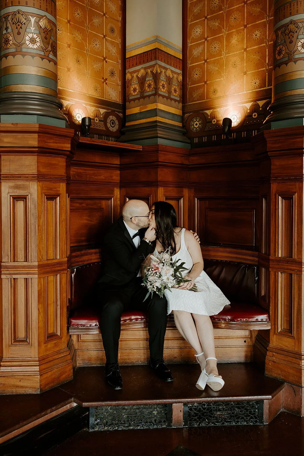 A bride and groom demonstrating how to plan an elopement at providence city hall