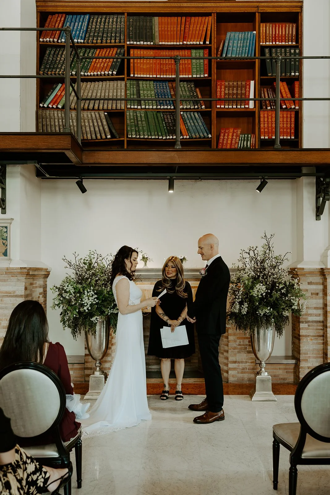 A birde and groom at their elopement after learning how to plan an elopement at boston public library