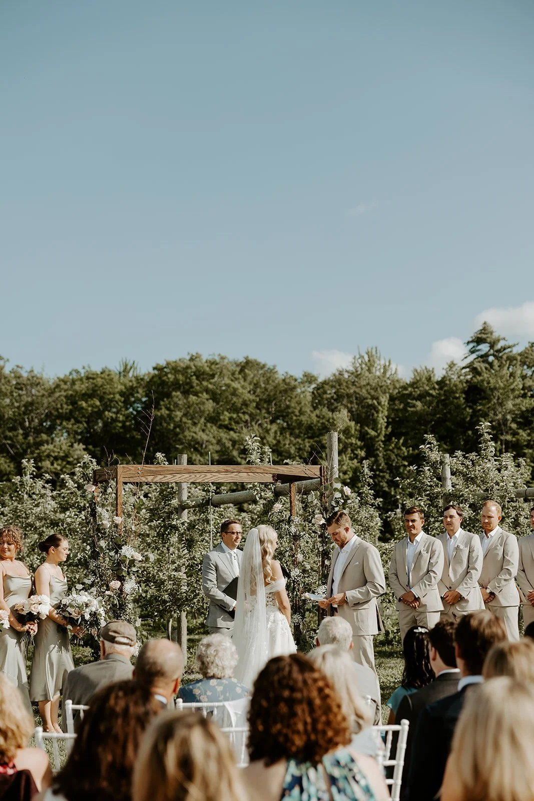 A wedding ceremony in the vineyards at the greenery at mckenzies farm